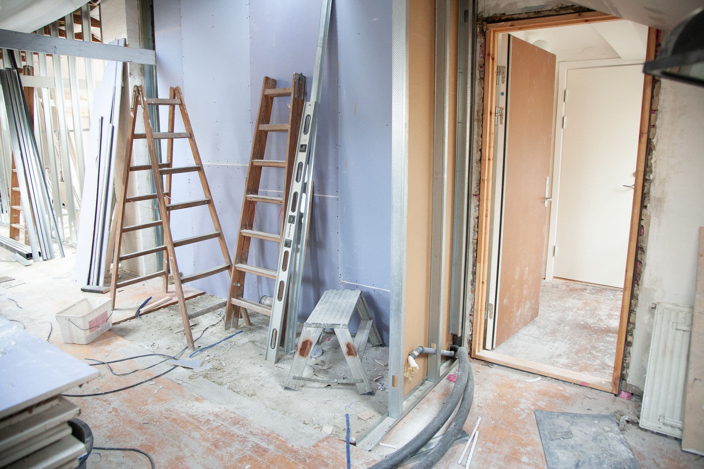 Interior mid fit-out with stud framing, plasterboard and ladders