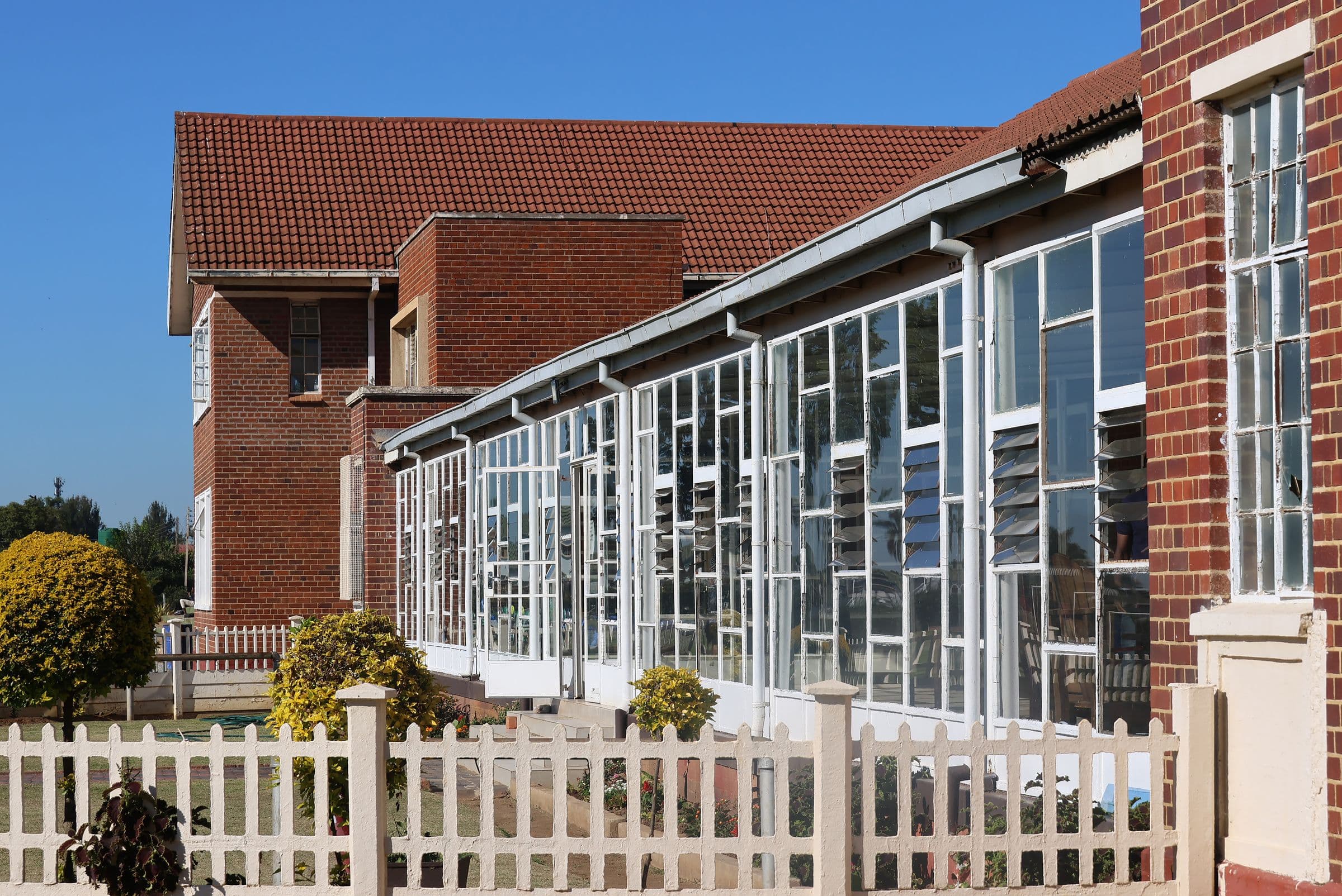 Low-rise brick community building with large windows