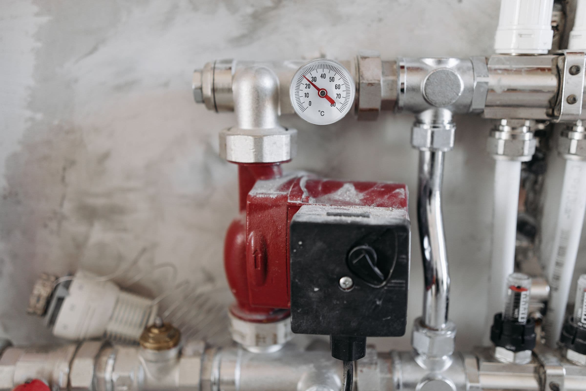 Circulation pump and gauge on a plant-room manifold